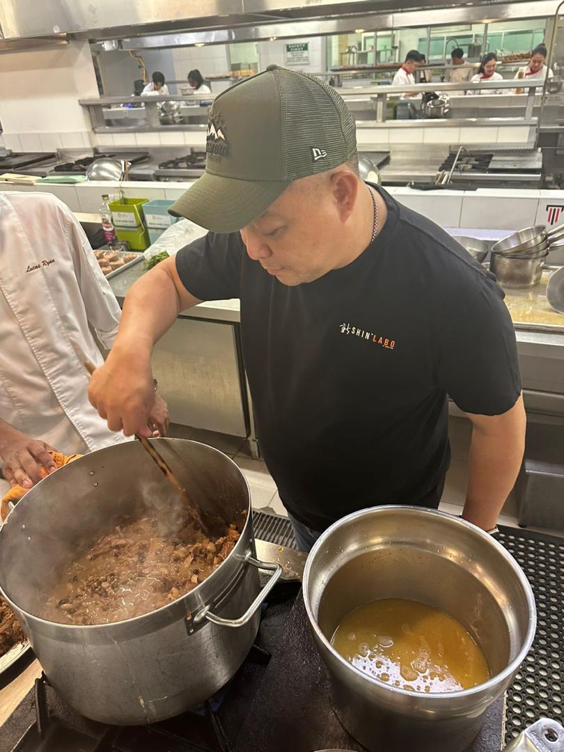 The practical workshop at Taylor's Culinary Institute, students working alongside James Won