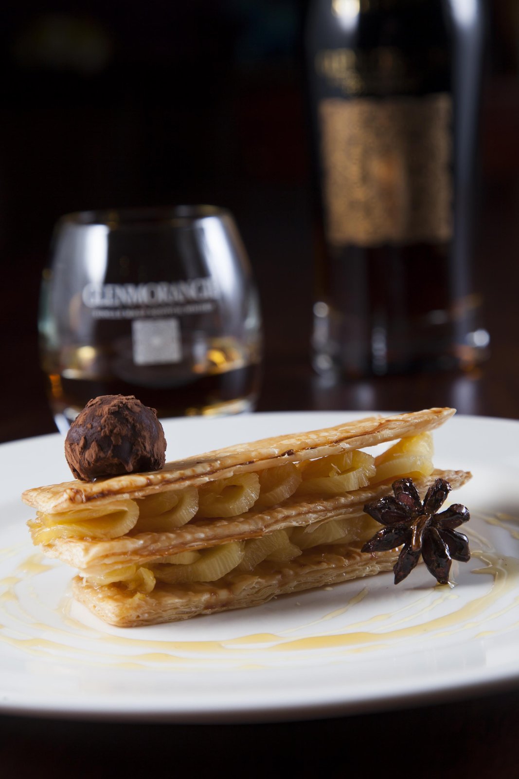 Fire-roasted pineapple mille-feuille with handmade dark-chocolate truffle — paired with Glenmorangie Signet