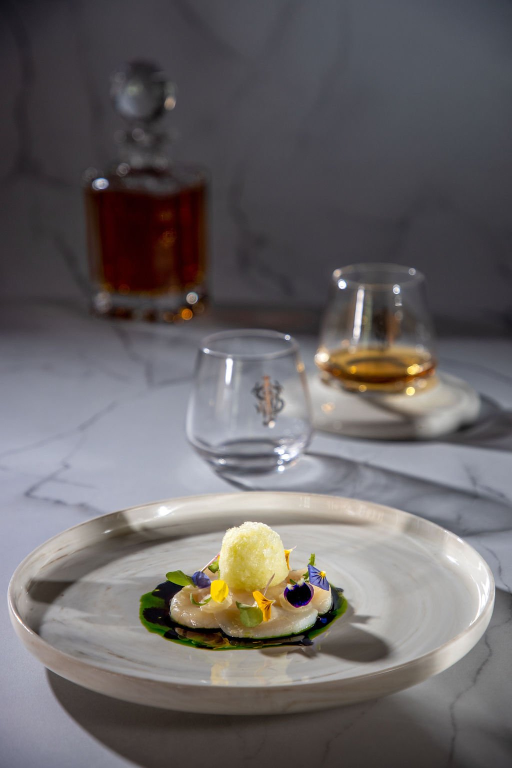 Discover Rarity fish course — roasted Hokkaido scallop with yam bean purée, pickled turnip, jalapeno granita, wasabi and yuzu dressing, chive and dill oil, black garlic oil.